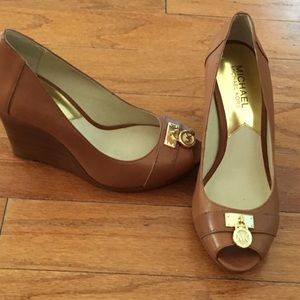New, never worn Michael Kors wedges.