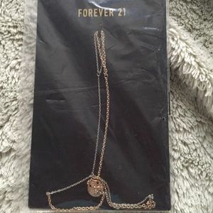 Bracelet connects to finger;assorted earnings