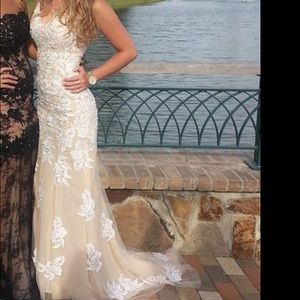 A white and tan prom/wedding dress