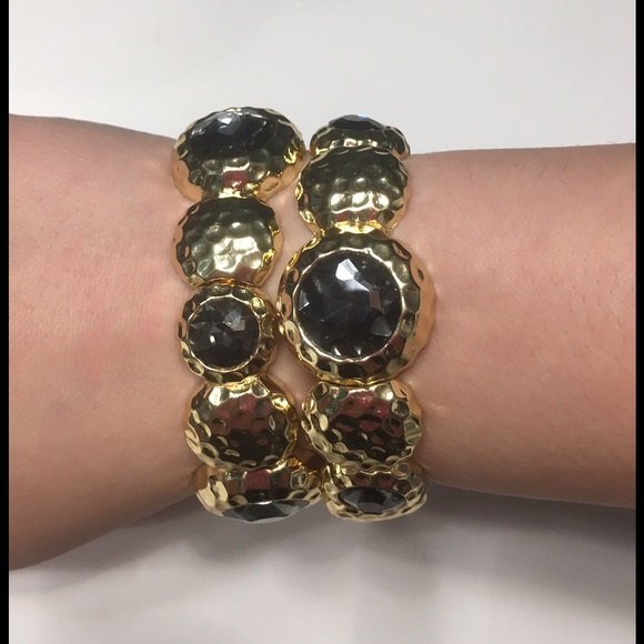 Set of Two Charming Charlie stretch bracelets.