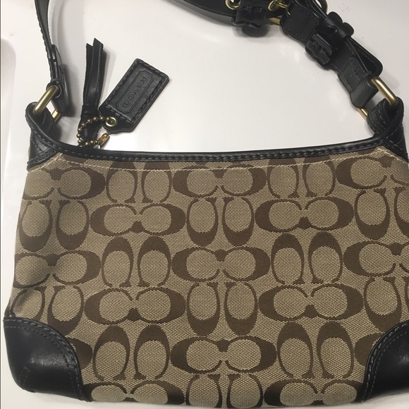 Like new Coach brown logo with black handles bag