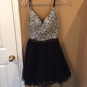 A pretty backless homecoming/prom dress.