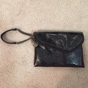 Henri Bendel envelope wristlet in cosmic black