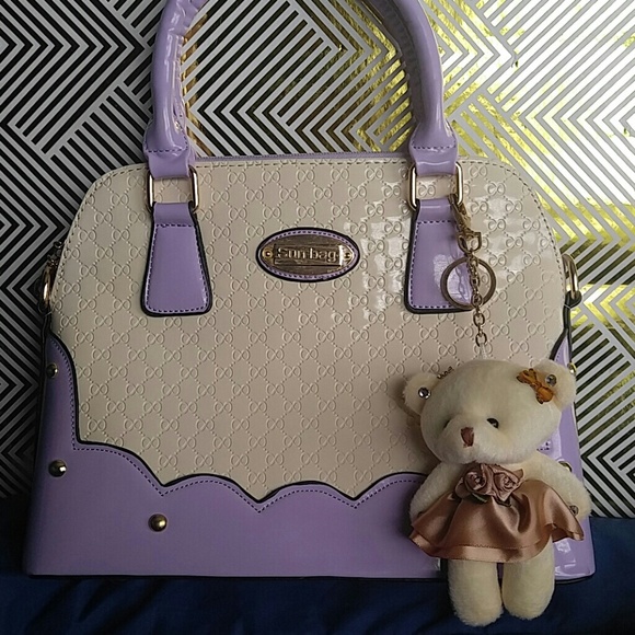 Purple and white handbag
