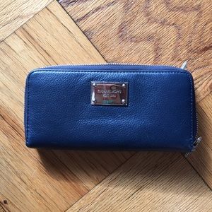 Michael Kors genuine leather wallet.