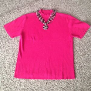 Pink shirt sleeved sweater.
