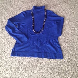 Blue long sleeved lightweight sweater.