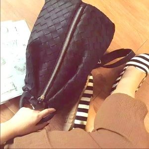 Woven backpack with lock