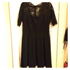 Very cute! Lacy tea length black dress