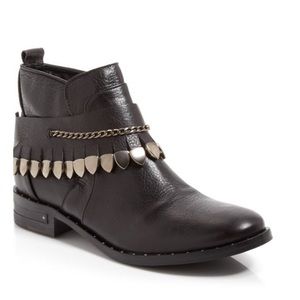 Edgy leather booties w removable strap.