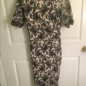 Sexy laced black dress. Zipper all down back