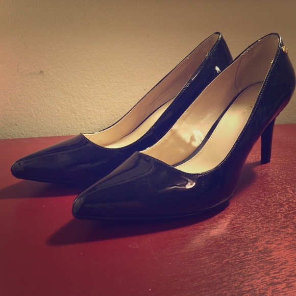Black patent leather Calvin Klein pointed heels.