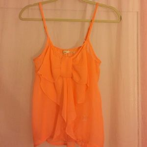 Peach top with a large bow