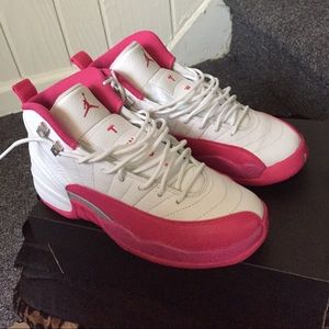 Pink and white Jordan 16s