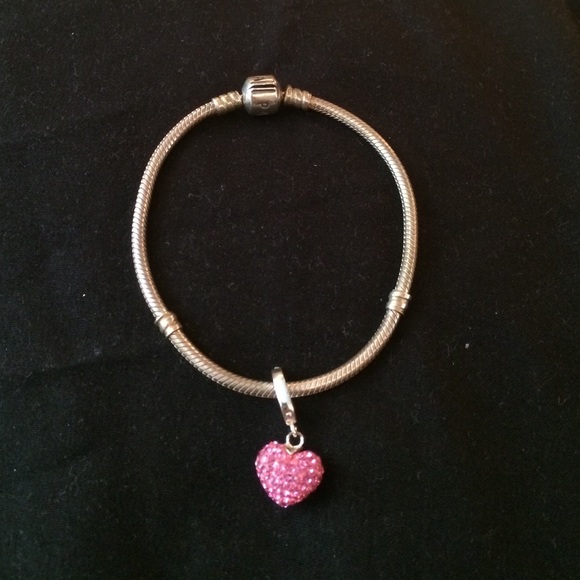 Pandora bracelet with pink heart charm
