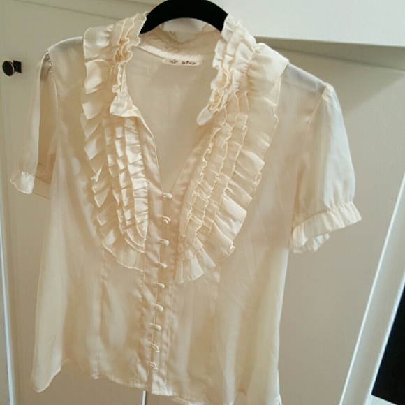 Cream ruffle day to night blouse