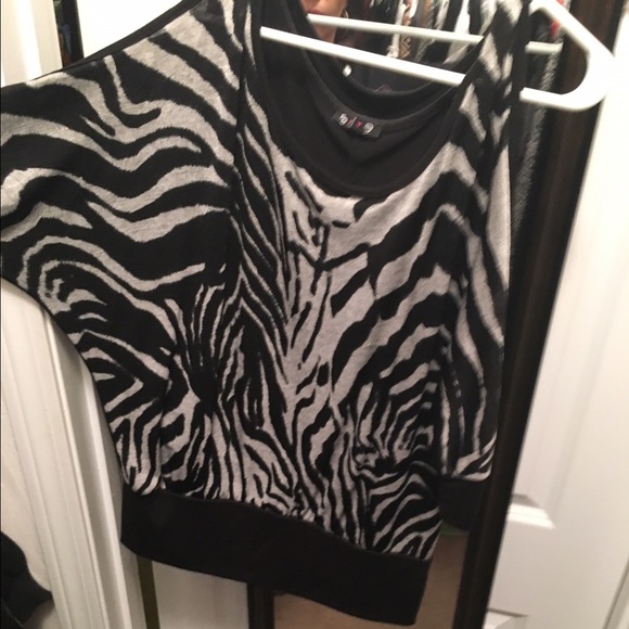 Animal print top with slits on arms.