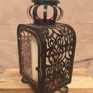 Metal lantern with a candle
