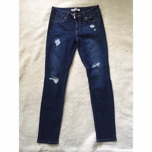 Straight leg/skinny distressed dark wash jean