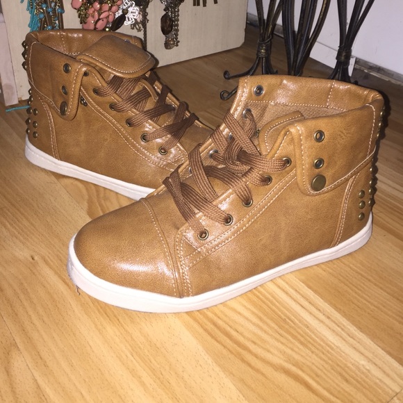 Brown sneakers with gold embellishments