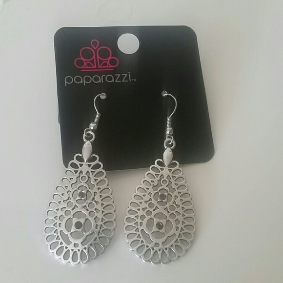 Silver earrings with purple rhinestones