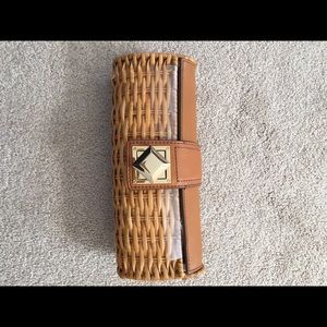 Clutch in tan color .