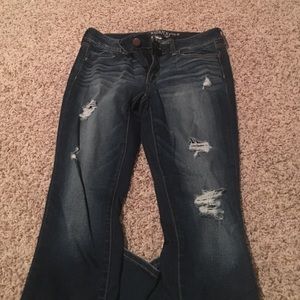 Dark blue jeans with holes