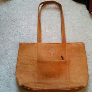 Vintage, orange carry all embossed leather bag