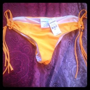 Cheeky orange bathing suit bottoms