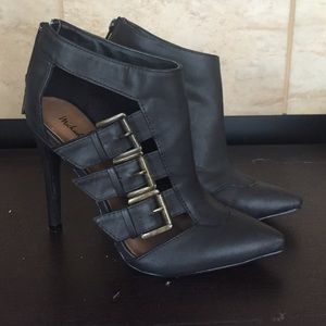 Black ankle booties or heels.