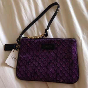 Coach purple wristlet.