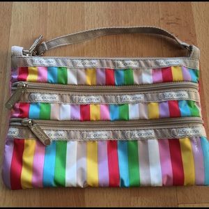 LeSportsac triple zip rainbow striped wristlet