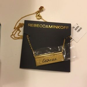 Gold "Cancer" sign necklace with music box