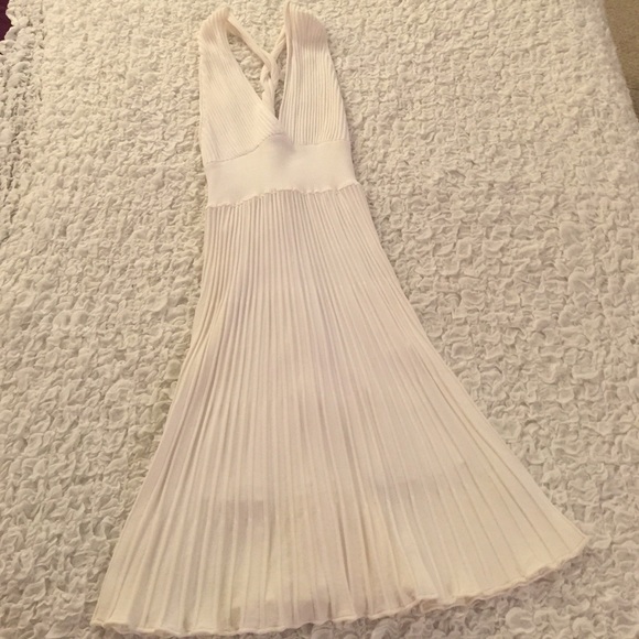 White pleated knee length dress