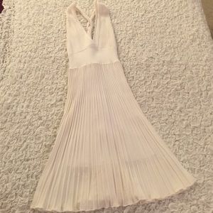 White pleated knee length dress