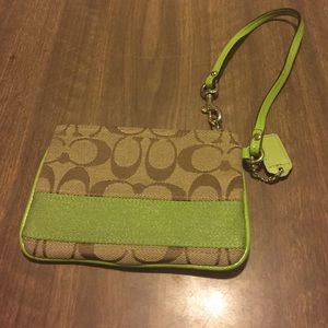 Coach wristlet with lime green embellishment