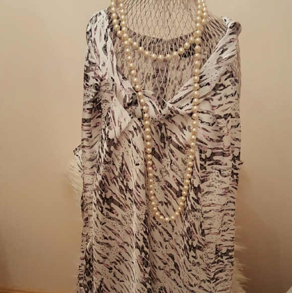 Sleeveless flow top very soft and silky.