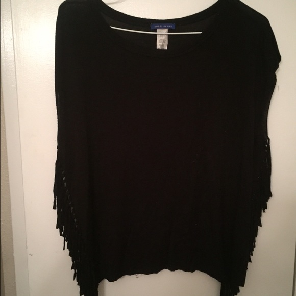 Black shirt, fringe on sides.
