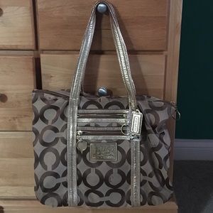 Gold coach purse with teal interior