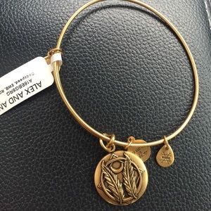 Gold God speed Alex and Ani bangle