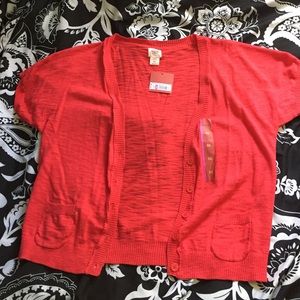 Short sleeve pink cardigan.