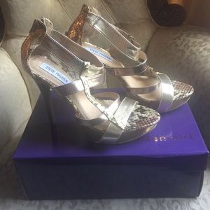 Steve Madden Gold and snakeskin sandals.