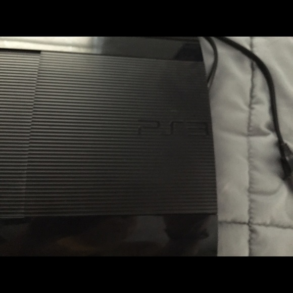 PlayStation 3 plus 2 controllers and charging dock - Picture 2 of 4