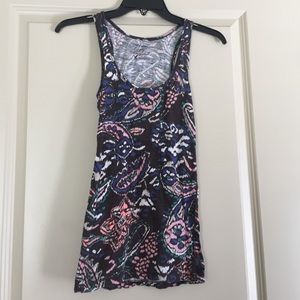 An XS brown tank top with colored patterns.