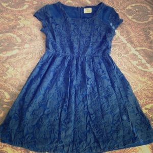 Blue lace skater dress with cap sleeves.