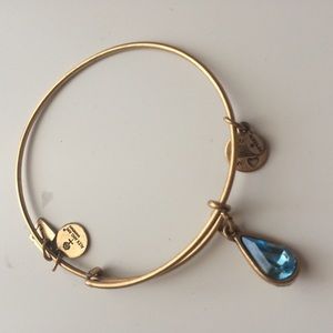 Gold Alex & Ani blue charm bangle