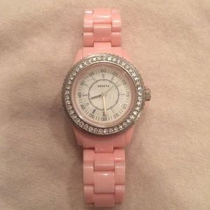 Pink watch with crystal surrounding face