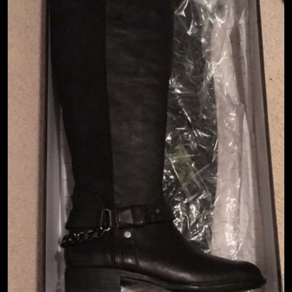 Black riding boots over the knee