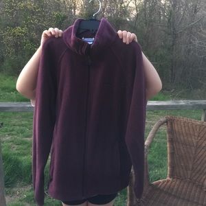 Purplish/maroon Columbia jacket.