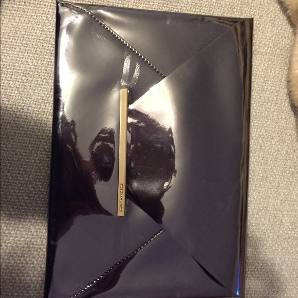 Sold !!!Bcbg silver clutch with tags